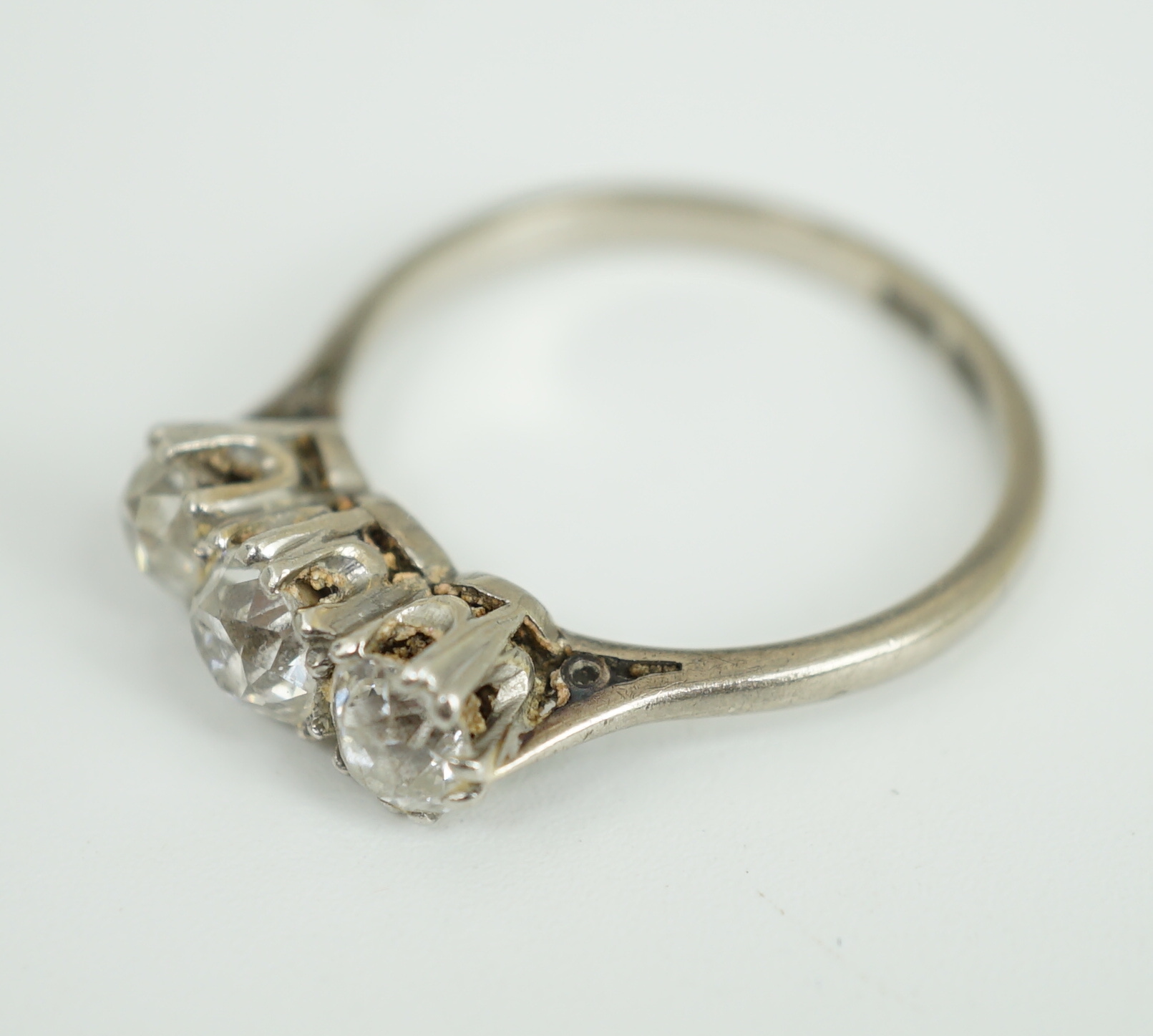 An 18ct white gold, platinum and three stone diamond set ring